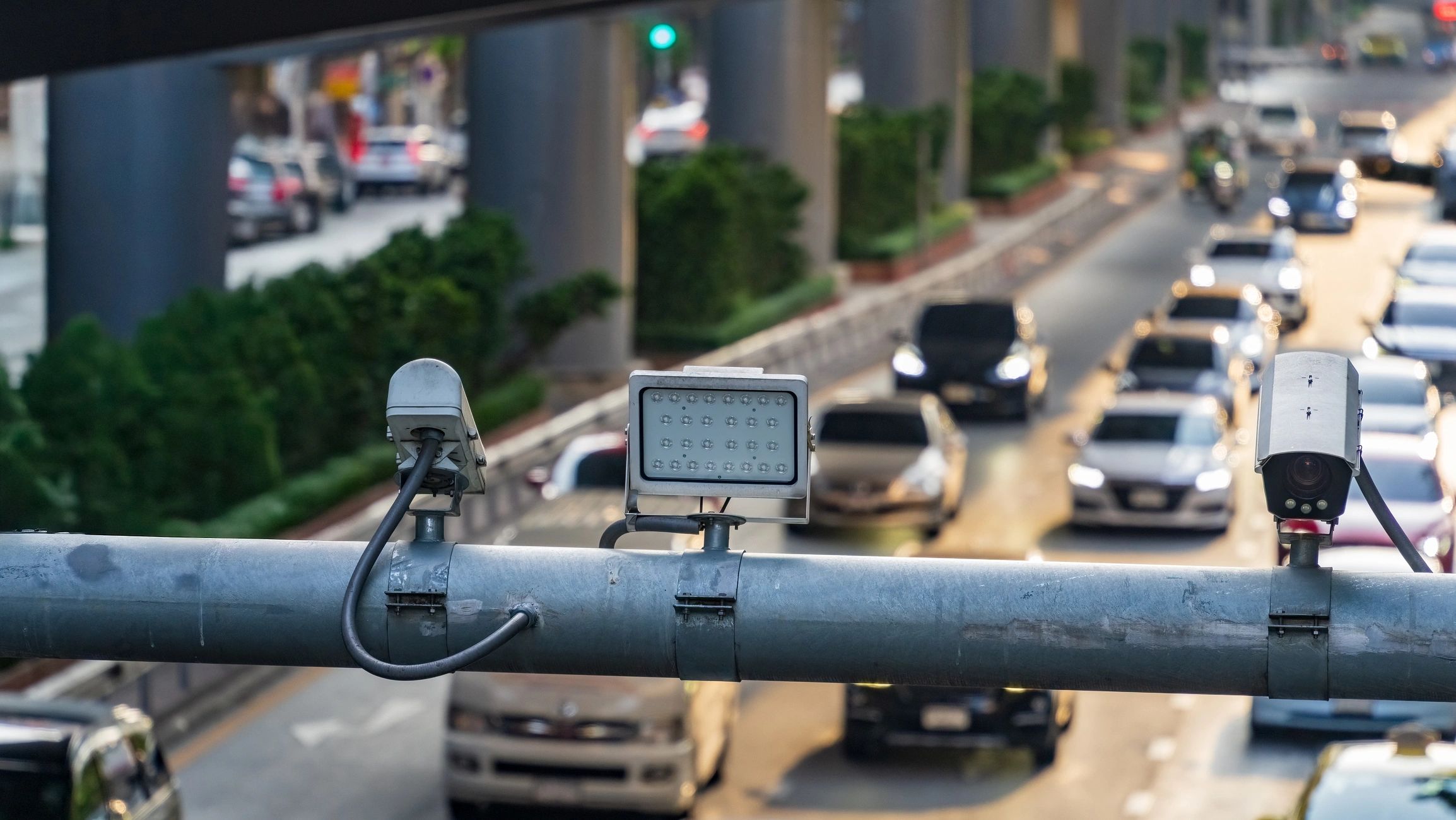 Surveillance cameras monitoring a busy road
